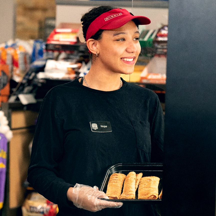 person in visor selling food