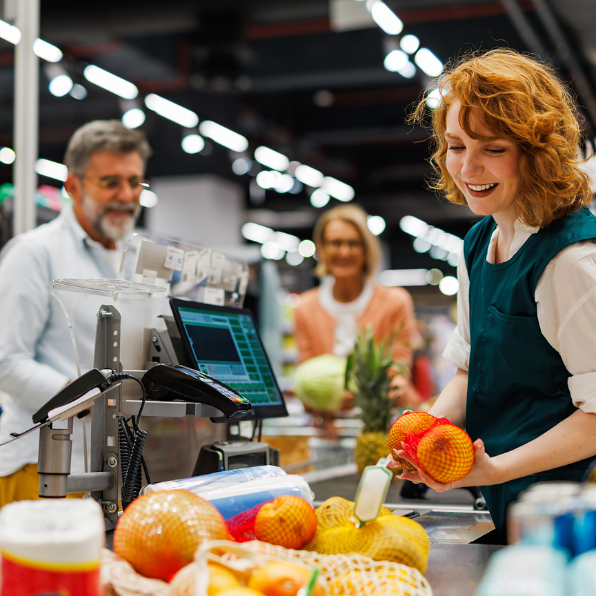 people checking out at grocery store