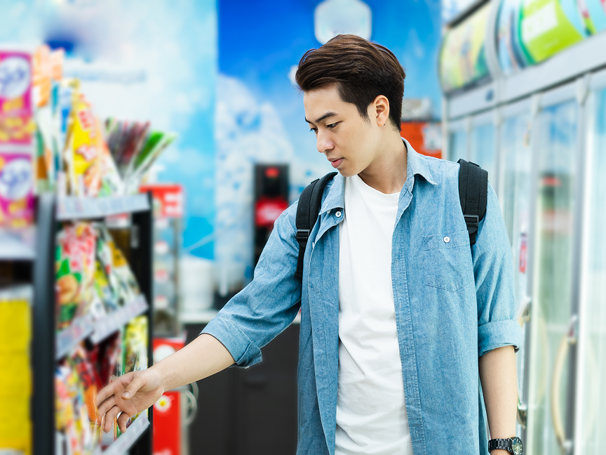 shopper in button-down shirt at convenience store