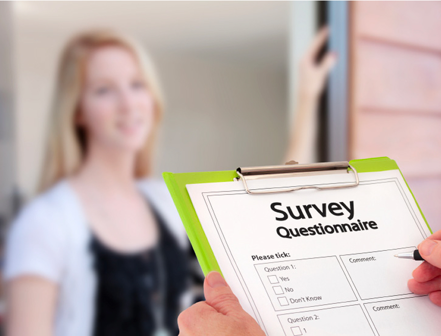 Person holding a clipboard with a survey questionnaire form, giving the survey to a woman standing in a doorway